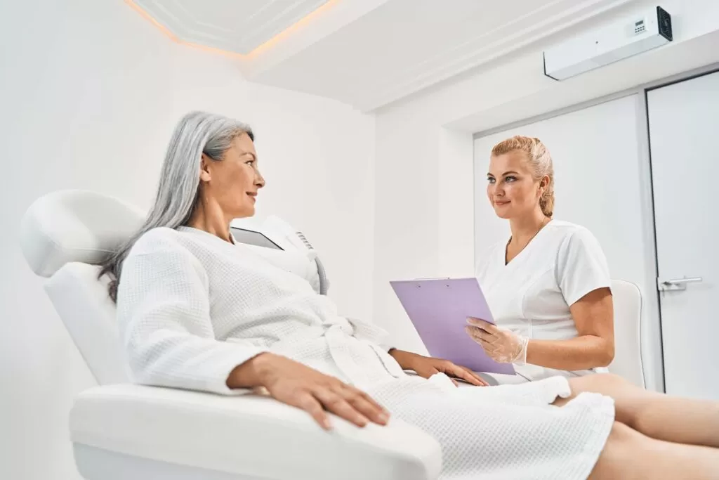 Breast Augmentation | Services 3 pleased-blonde-woman-working-in-beauty-clinic-NW6FVAE.jpg